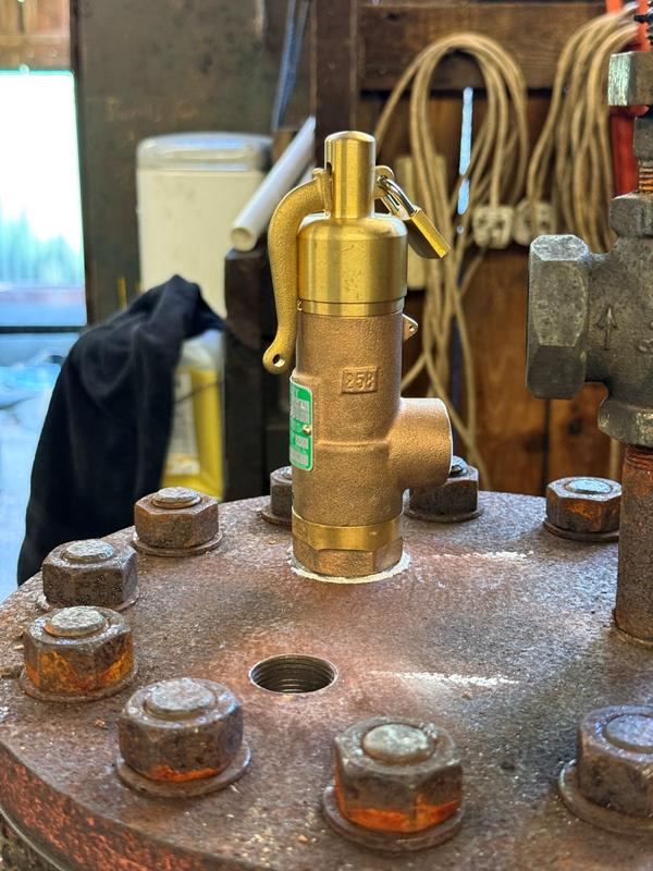 Fitting the new safety valves. Photo: Alex Forshaw.